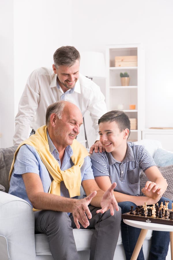 Teenager Playing Chess with his Grandfather · Free Stock Photo