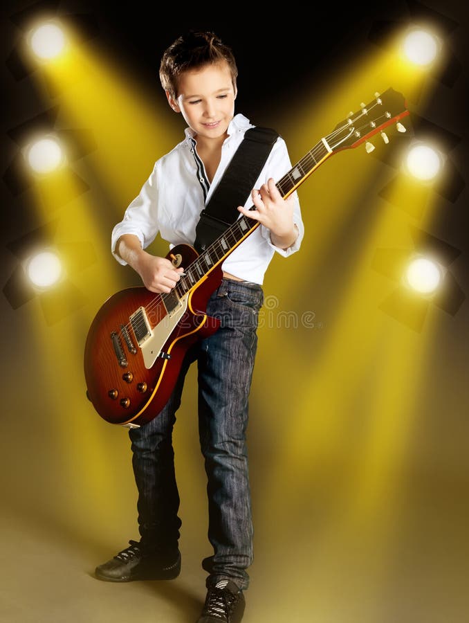 Boy Playing on Electric Guitar on the Stage Stock Photo Image of song