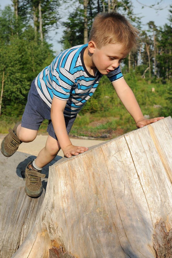 Boy playing in forest