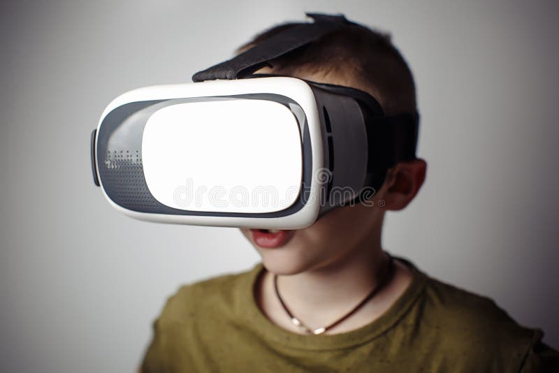 Boy Playing Mobile Game App on Device Virtual Reality Glasses on