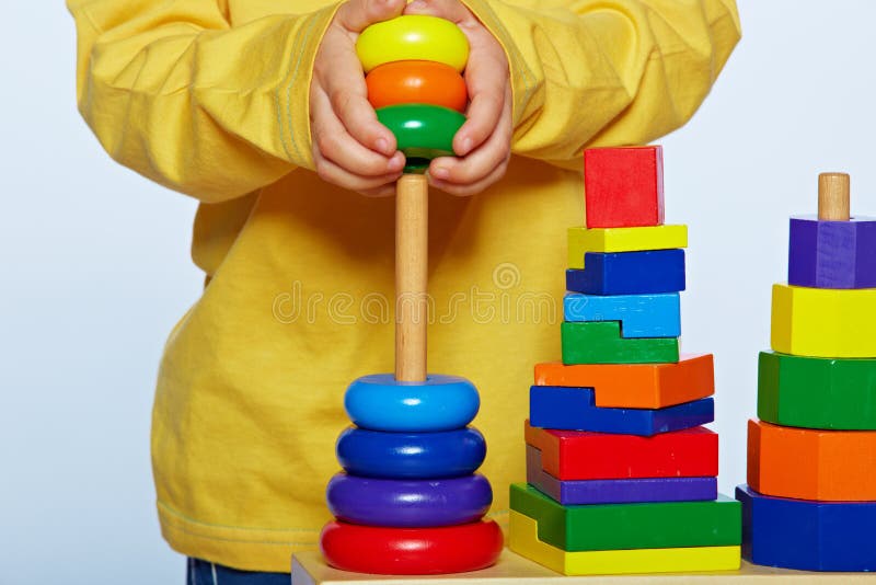 Boy playing with pyramid