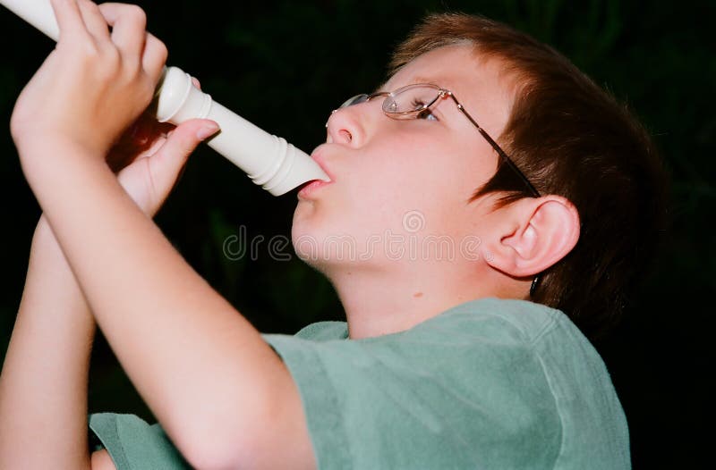 Boy playing a recorder stock image. Image of recorder 9013741