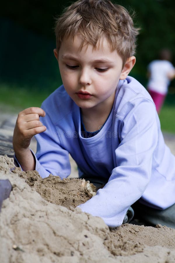 Boy playing in the sandbox