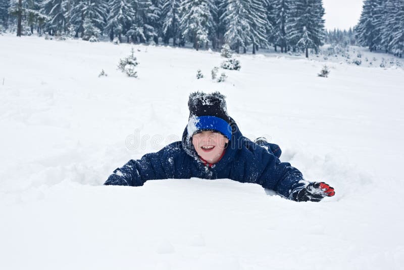 Boy playing in the snow