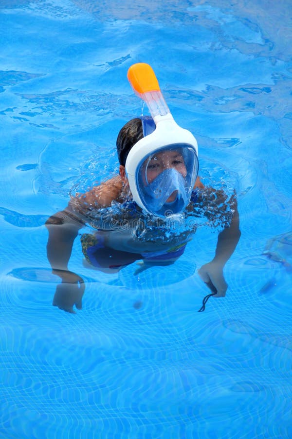 A Boy is Diving in Swimming Pool with Easybreath Mask Editorial Stock Image - of swimmingpool, trees: 94709394