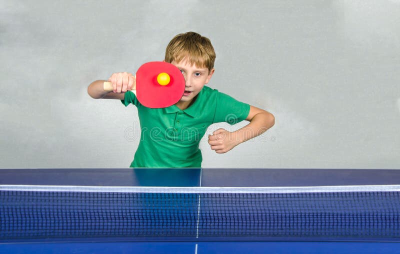 Boy playing table tennis stock photo. Image of table 61258550