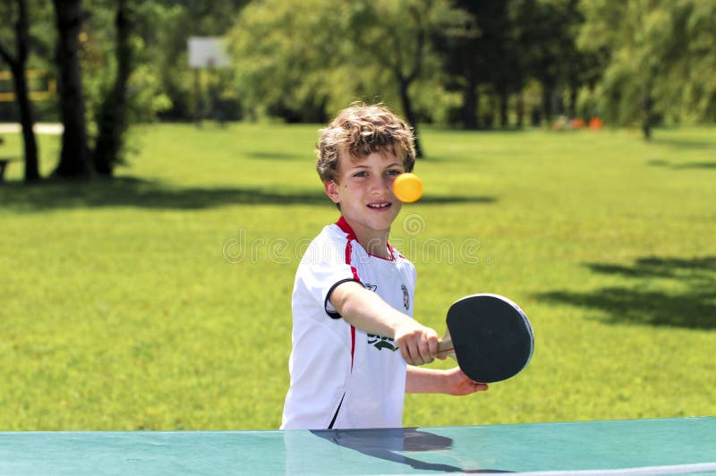 Boy playing table tennis stock image. Image of expressive 6731067