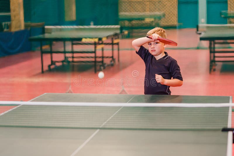A Boy Playing Table Tennis In The Tennis Hall Stock Image Image of