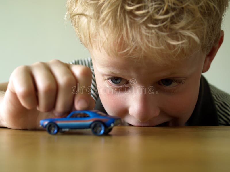 Boy playing with toy car