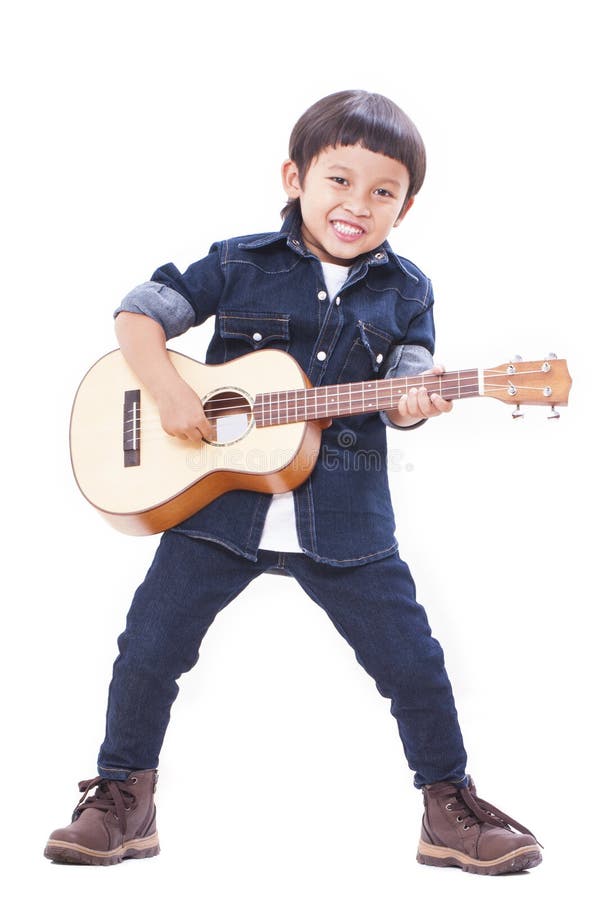Boy playing ukulele stock image. Image of education, background 41531969