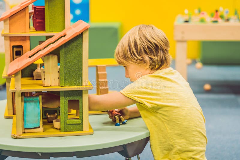 Boy Playing with Wooden House in Kindergarten Stock Image Image of
