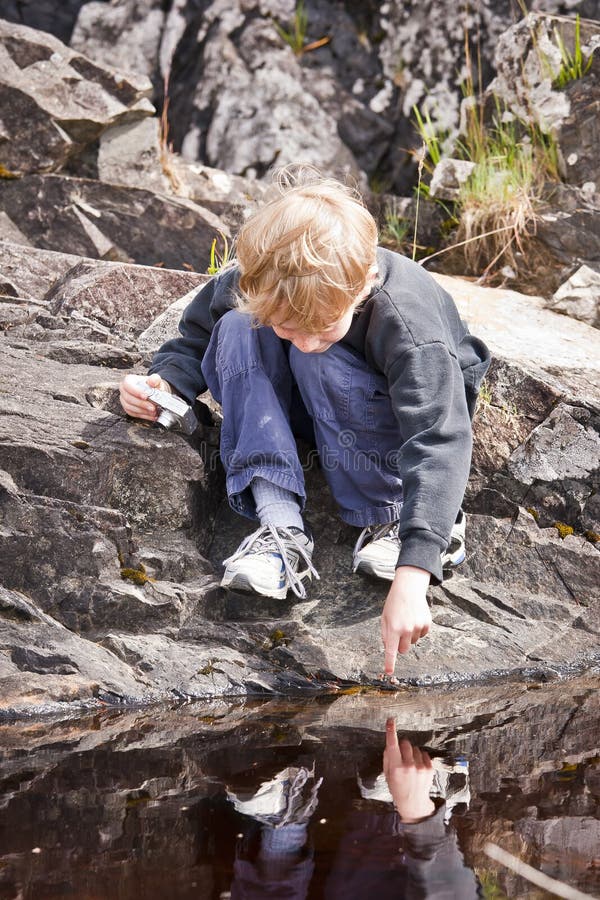 Boy Pointing At A Reflection royalty free stock photos