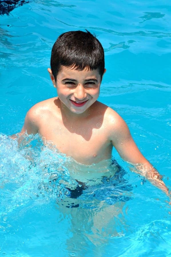 Boy in pool stock image. Image of funny, innocent, blue 58415399