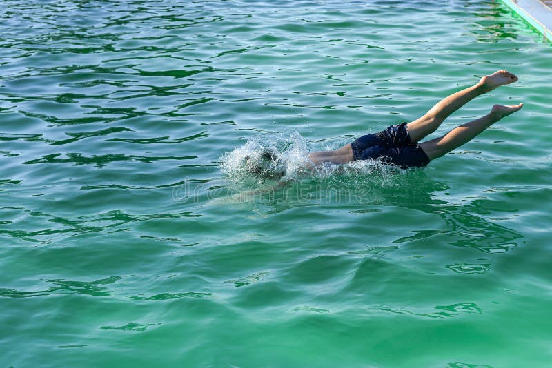 The Boy in the Pool Jumps into the Cold Water Stock Image Image of