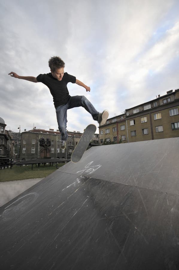Boy practicing skate in a skate park. Boy practicing skate in a skate park