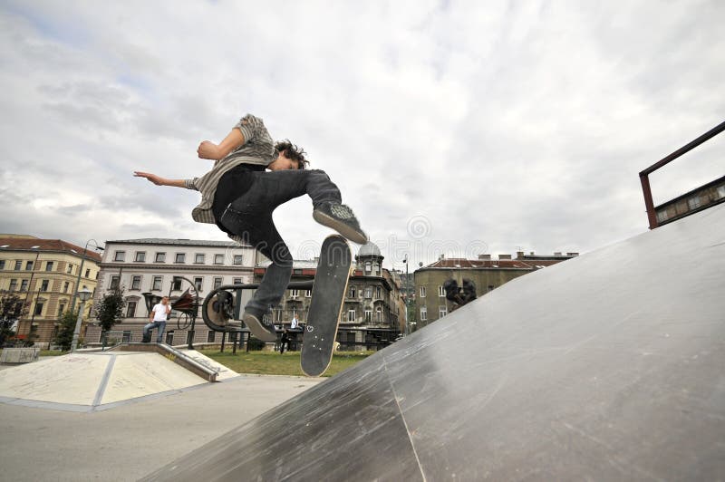 Boy practicing skate in a skate park. Boy practicing skate in a skate park