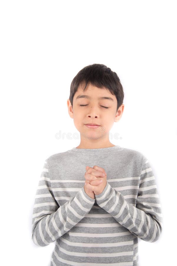 Boy praying meditating on white background stock photos Boy praying meditating on white background stock photos