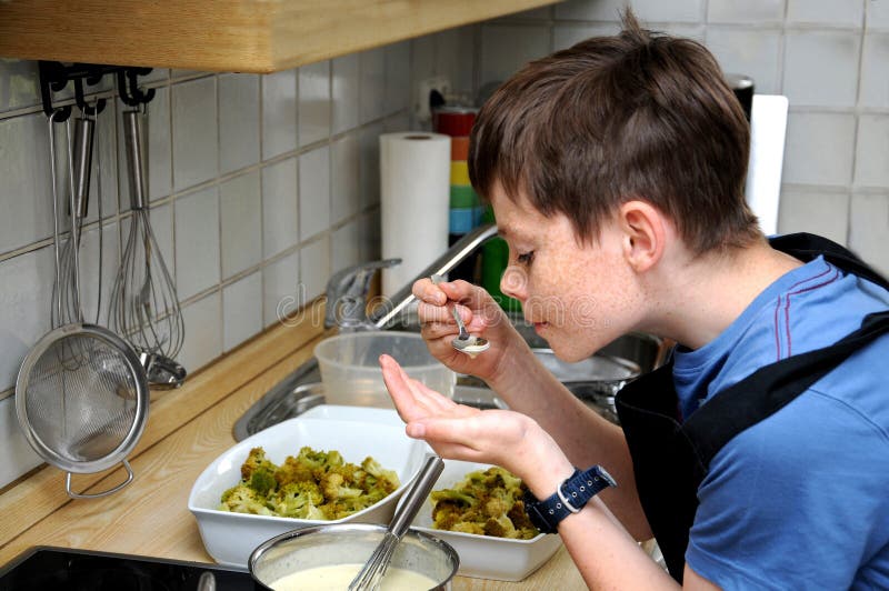 Boy Preparing Vegetarian Meal and Tastes the Sauce Stock Image Image of dish, cook 268246163