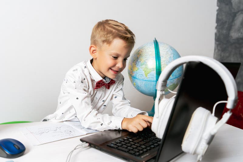 A Boy in Quarantine with a Laptop is Undergoing School Training
