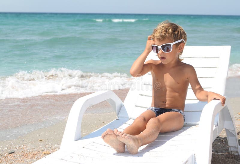 Boy relaxing on beach