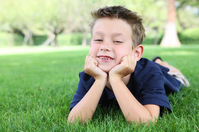 Boy Relaxing in Park stock image. Image of leisure, meadow - 6031005