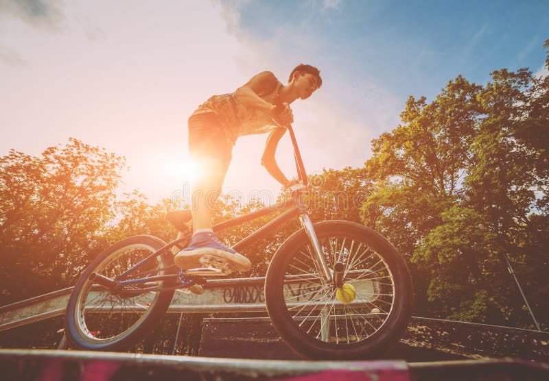Boy Riding a Bmx in a Park. Stock Image Image of culture, males