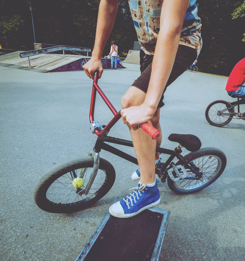 Boy Riding a Bmx in a Park. Stock Photo Image of cycle, hobbies