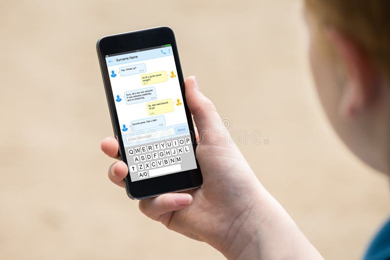 Boy`s Hand Holding Mobile Phone royalty free stock photo