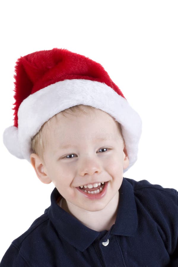 Handsome boy in santa claus hat isolated on white. Handsome boy in santa claus hat isolated on white