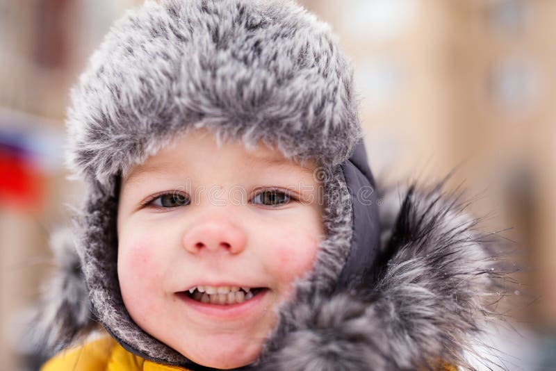 Boy sculpt snowman royalty free stock photography