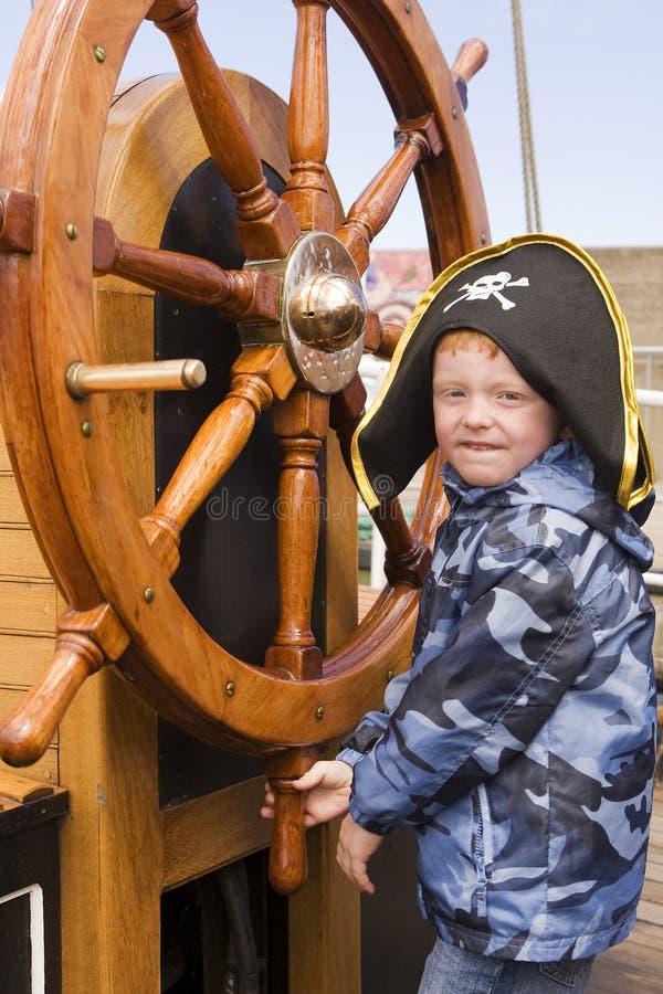 Boy at ships wheel