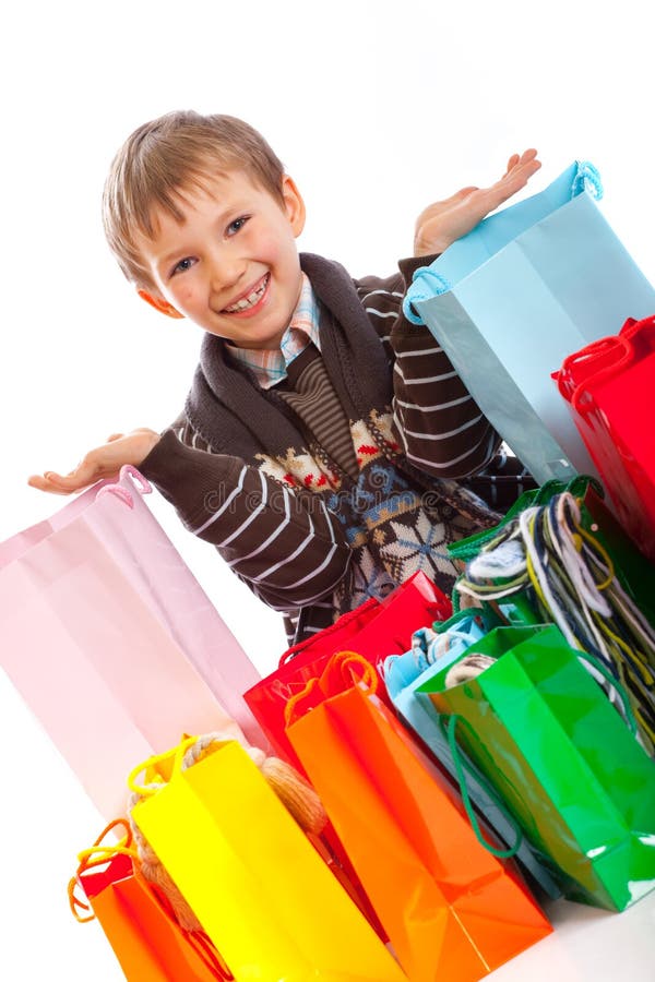 Boy with Shopping Bags stock image. Image of many, colorful 8187369