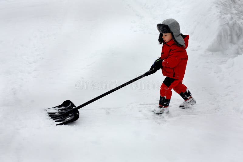 Boy shoveling snow