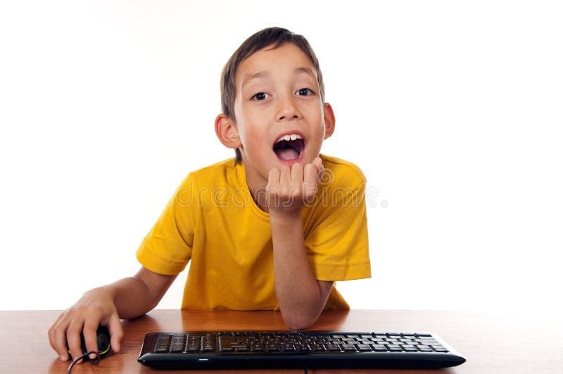 Boy sitting in front of computer