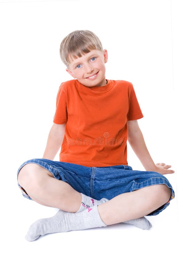 A Boy Sitting with Legs Crossed Stock Image Image of jeans
