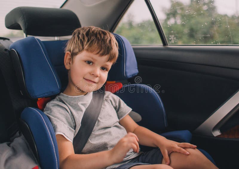 Boy sitting in safety car seat