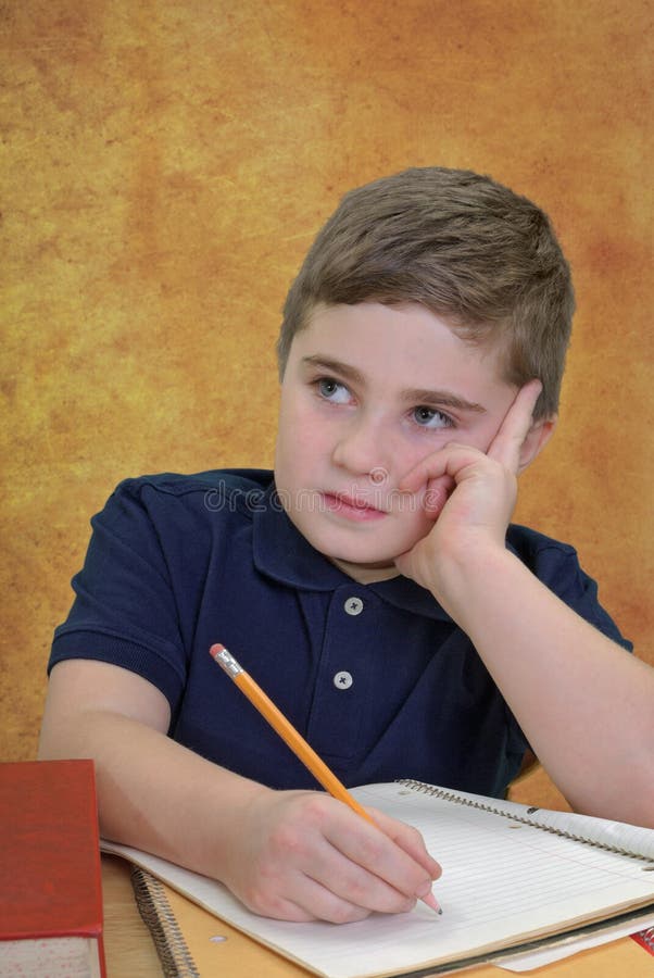 Boy Sitting School Desk stock image. Image of learning 22006339