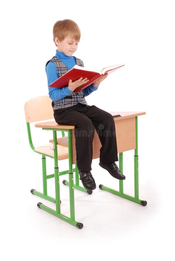 Boy Sitting on the School Desk and Holding Book Stock Photo Image of