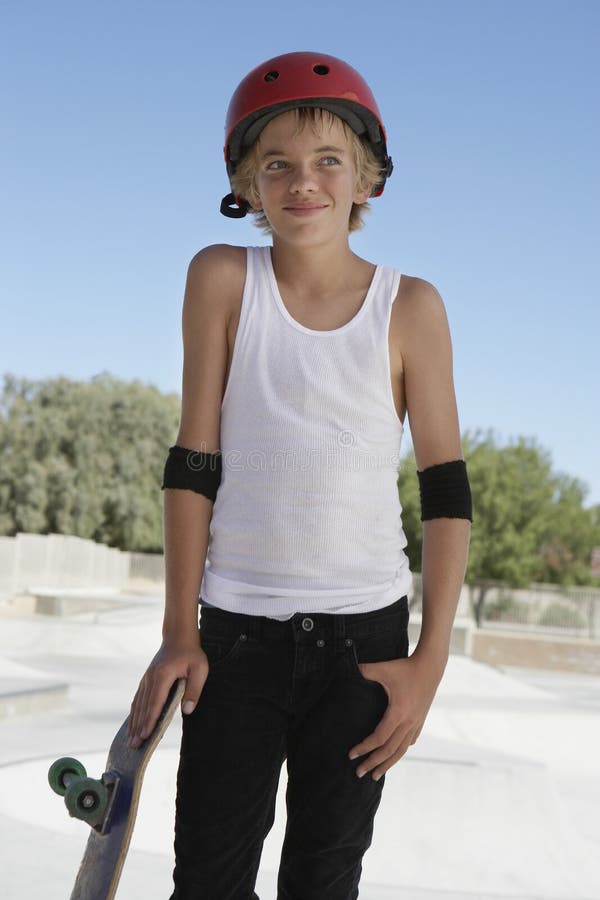 Boy with Skateboard Looking Away in Skate Park Stock Image - Image of ...