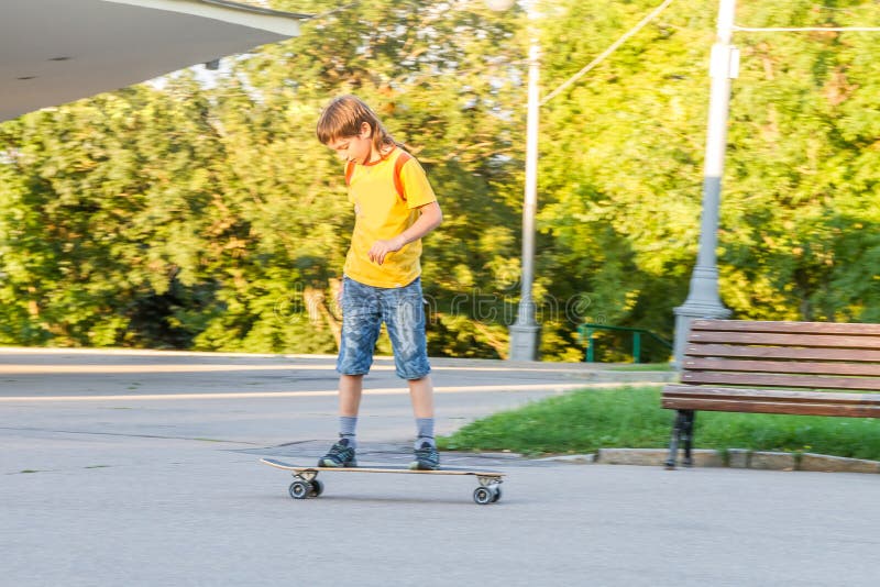 Boy skateboarding on natural background