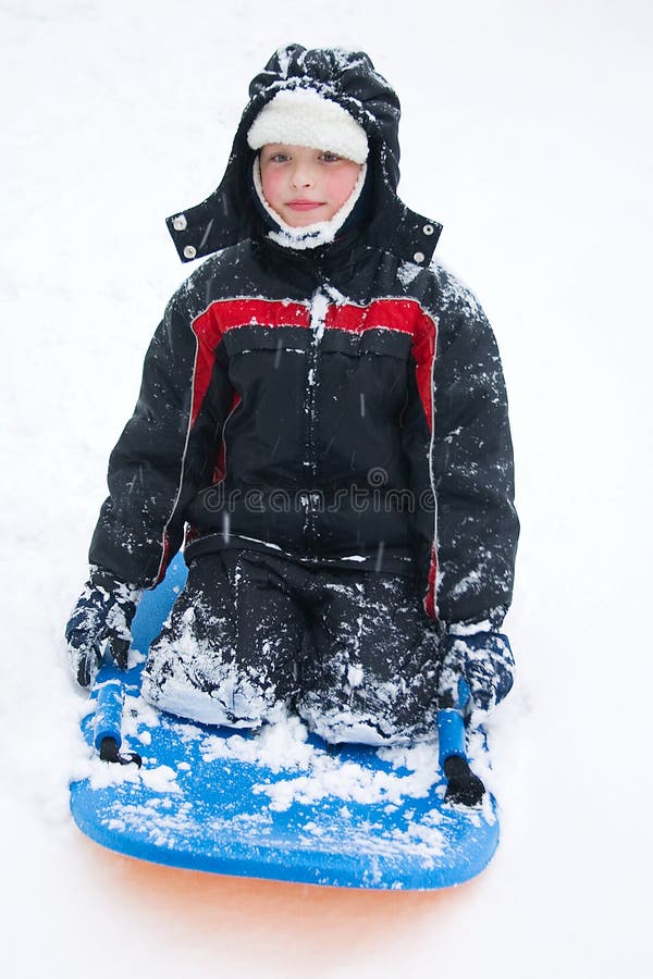 A boy on a sled stock photography A boy on a sled stock photography