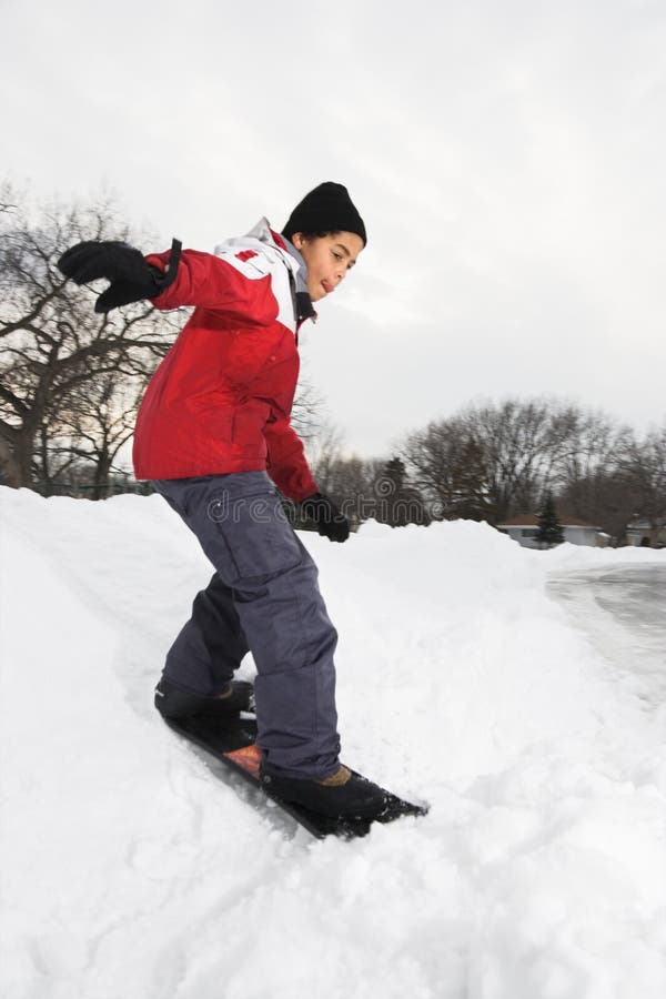 Boy snowboarding.