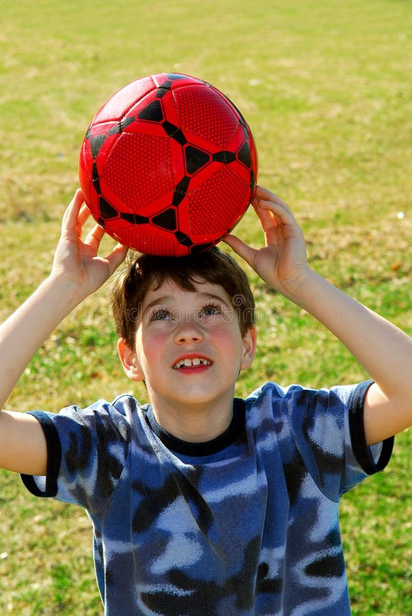 Boy with soccer ball stock photo. Image of play, holding 2296614