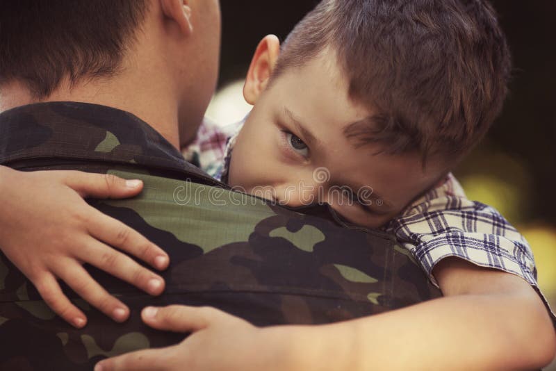 Boy and soldier in a military uniform