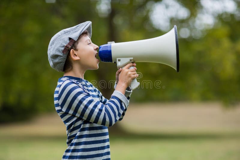 Boy speaking on megaphone stock image. Image of speaking 77905125