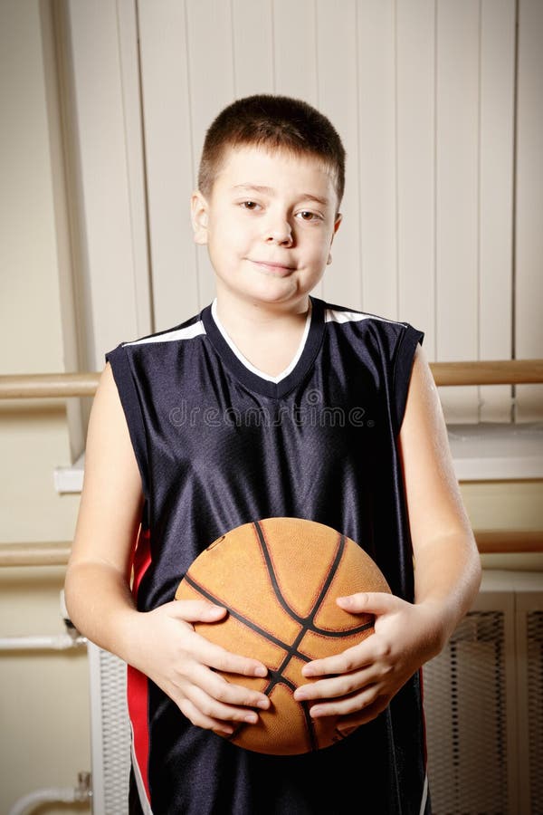 Boy Standing with Basketball Closeup Stock Image - Image of game ...