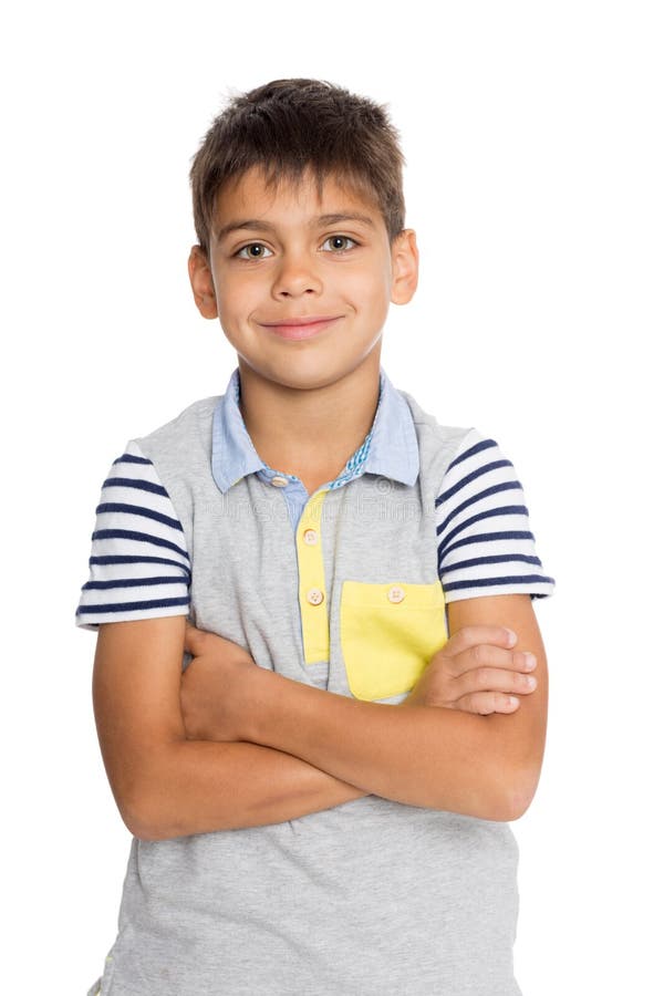 Boy standing with his arms crossed