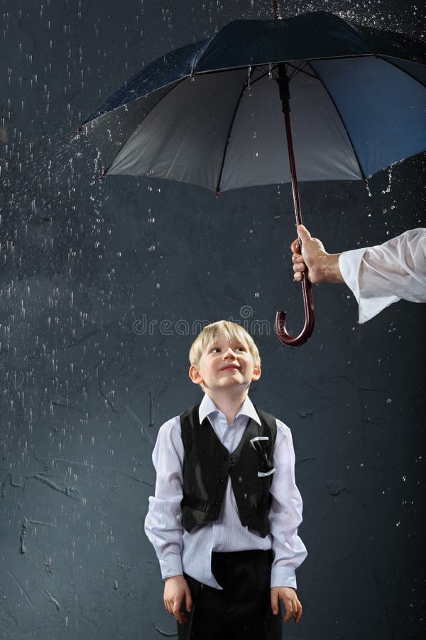 Boy Standing Under Umbrella In Rain Royalty Free Stock Photos Image