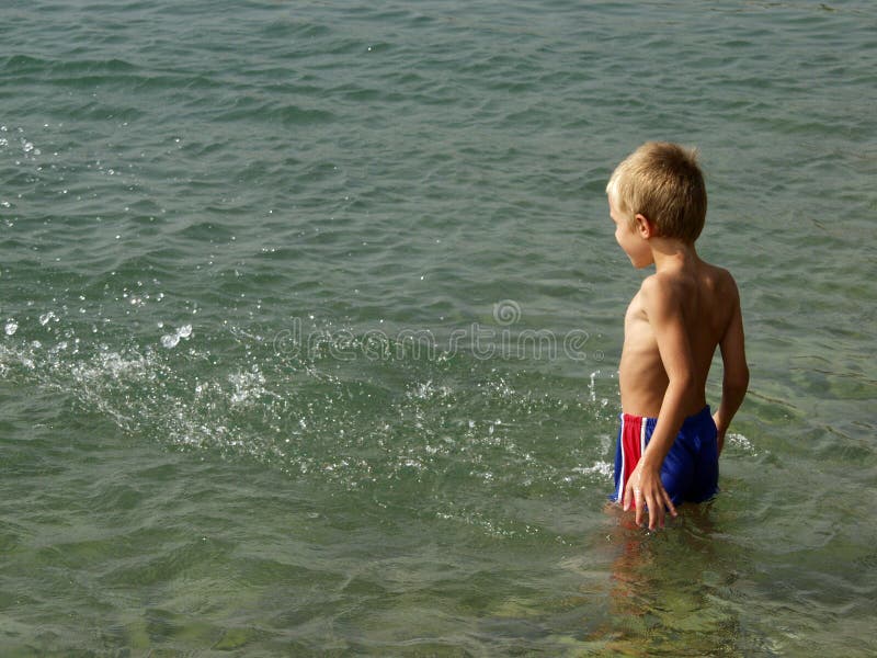 Boy standing in the water