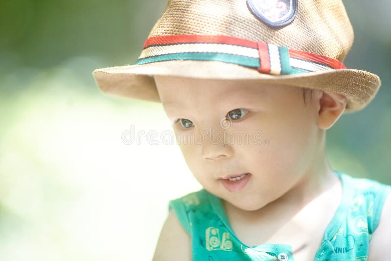 Boy in sun strawhat stock photo. Image of human, person 56872382